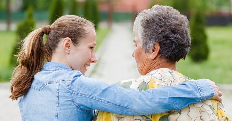 Senior female with a staff member